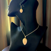 Hand made woolly mammoth tusk moon face necklace and matching earrings